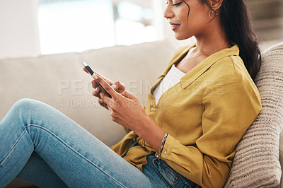 Buy stock photo Hands, phone and wellness with woman on sofa in living room of home for break or weekend time off. App, social media and relax with happy African person in apartment for communication or ecommerce