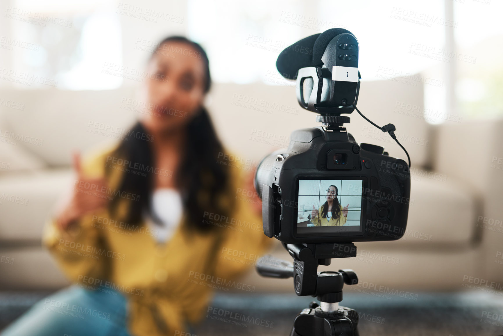 Buy stock photo Woman, content creator and thumbs up at apartment with digital camera for podcast, vlogging and recording video. Female person, home and living room as influencer with live screaming and broadcast