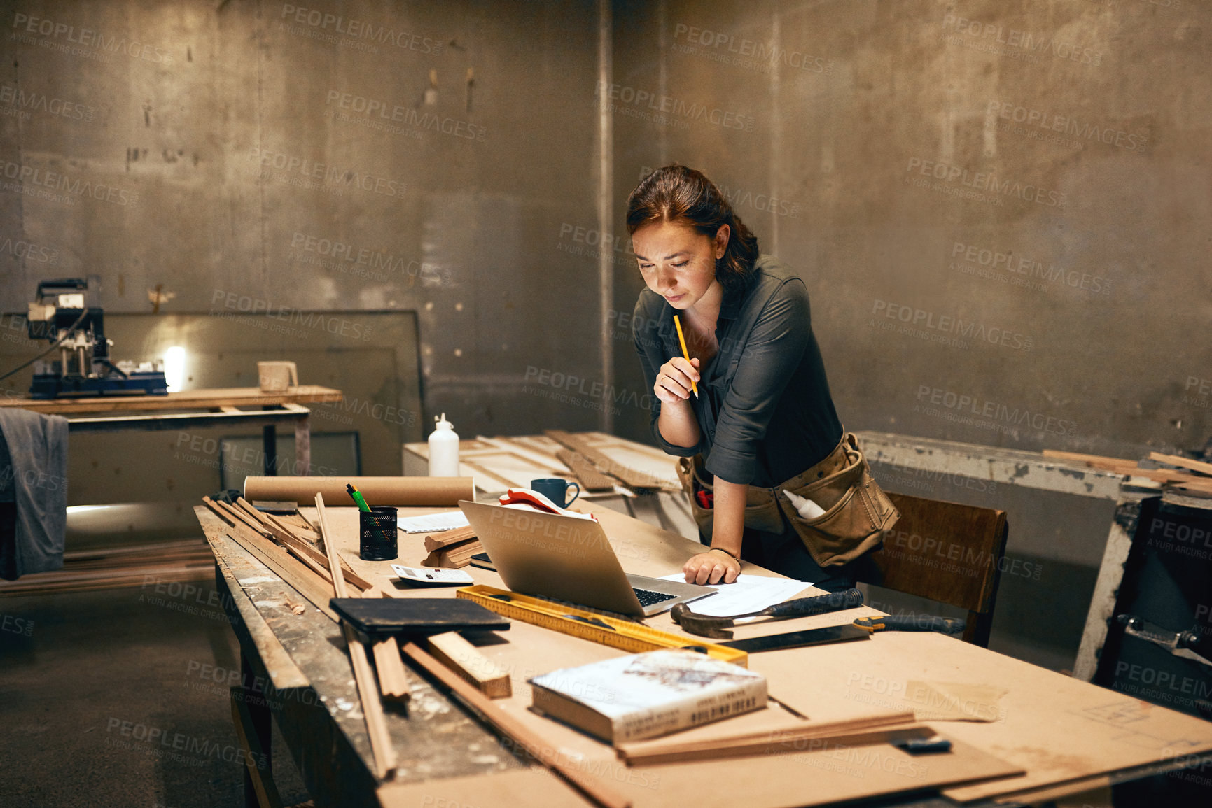 Buy stock photo Woman, wood or thinking at workshop laptop for planning, design process or contact at night. Carpenter, computer or idea in studio for manufacturing, furniture creativity or small business management