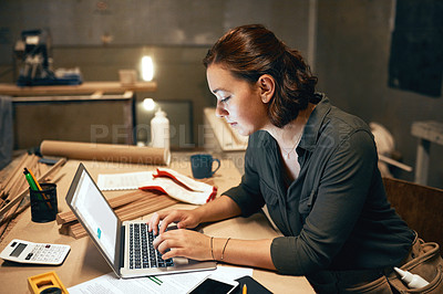 Buy stock photo Woman, wood and laptop in workshop for email, design process and invoice on screen at night. Carpenter, tech and connectivity in studio for material order, furniture creativity and startup management