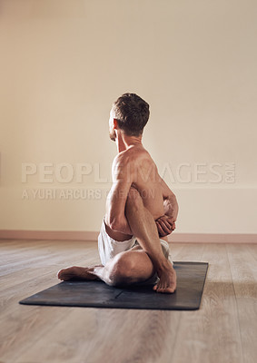 Buy stock photo Man, twist and flexible stretching in yoga on floor with back, mockup or exercise for balance in class. Yogi, person or pilates on mat in fitness studio with workout, zen or wellness for healthy body