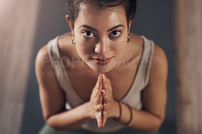Buy stock photo Portrait of an attractive young woman meditating and practicing yoga indoors
