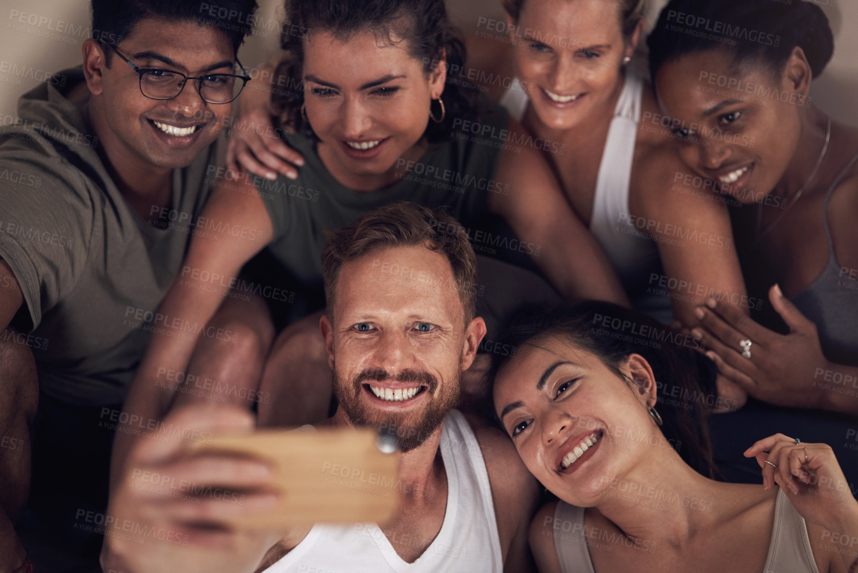 Buy stock photo Shot of a group of young people taking selfies after working out together in a yoga class