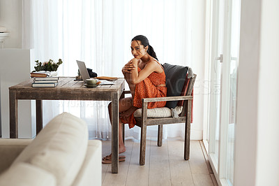 Buy stock photo Full length portrait of an attractive young businesswoman sitting alone in her home office during a day off