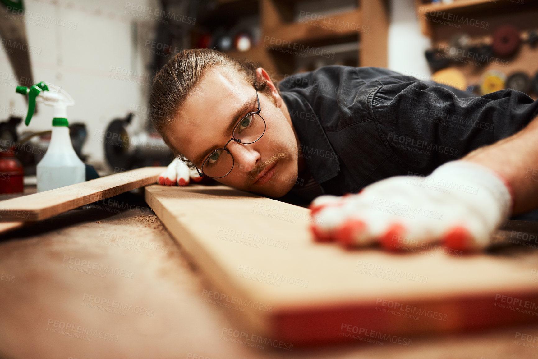 Buy stock photo Man, carpenter and wood with precision on workbench for project or woodwork at manufacture. Young, male person or designer with material, tools or equipment for DIY, artisan or crafting at workshop