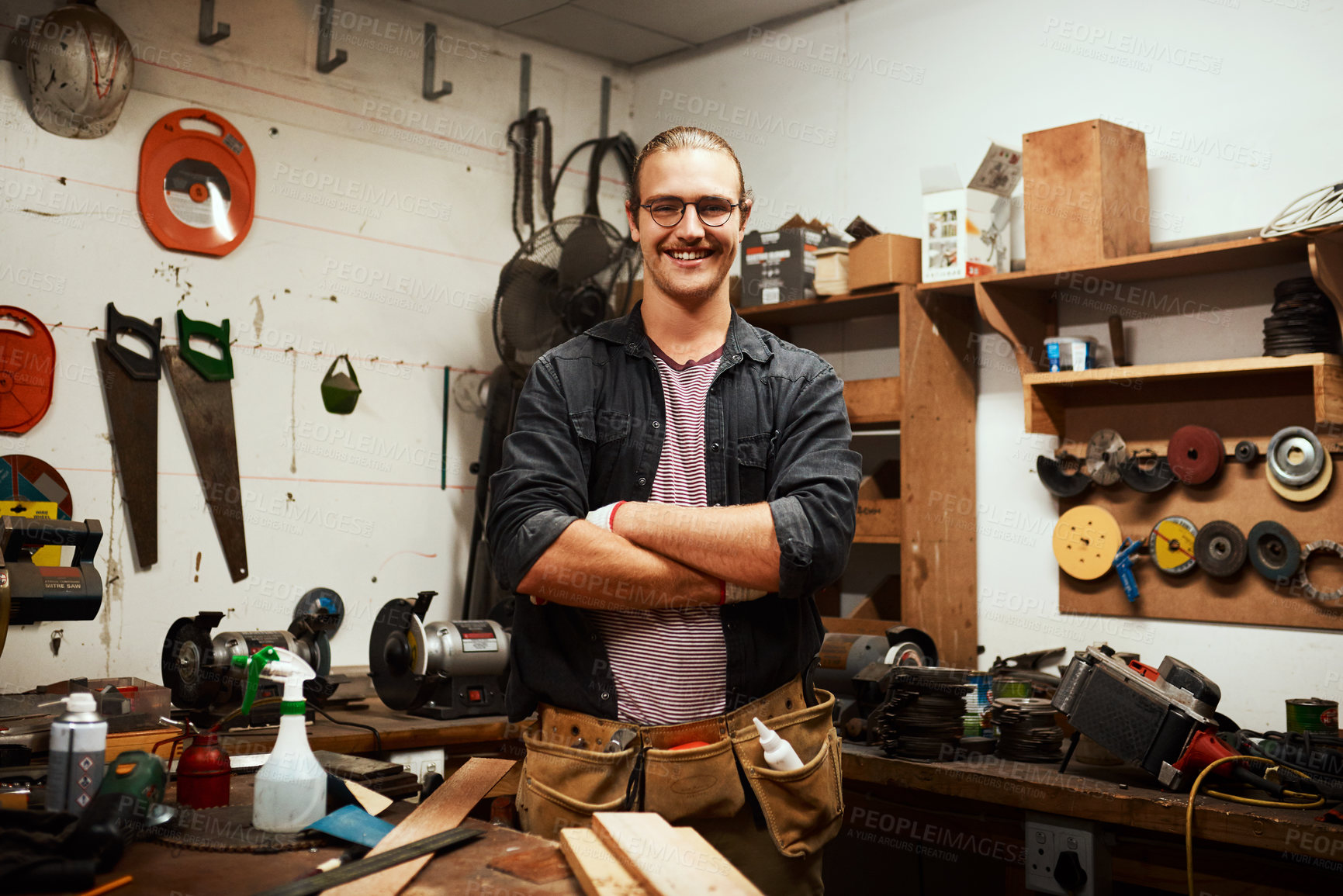 Buy stock photo Happy man, portrait and carpenter with confidence at workshop for woodwork, skill or talent in garage. Young, male person or professional artisan with arms crossed for timber or carpentry business