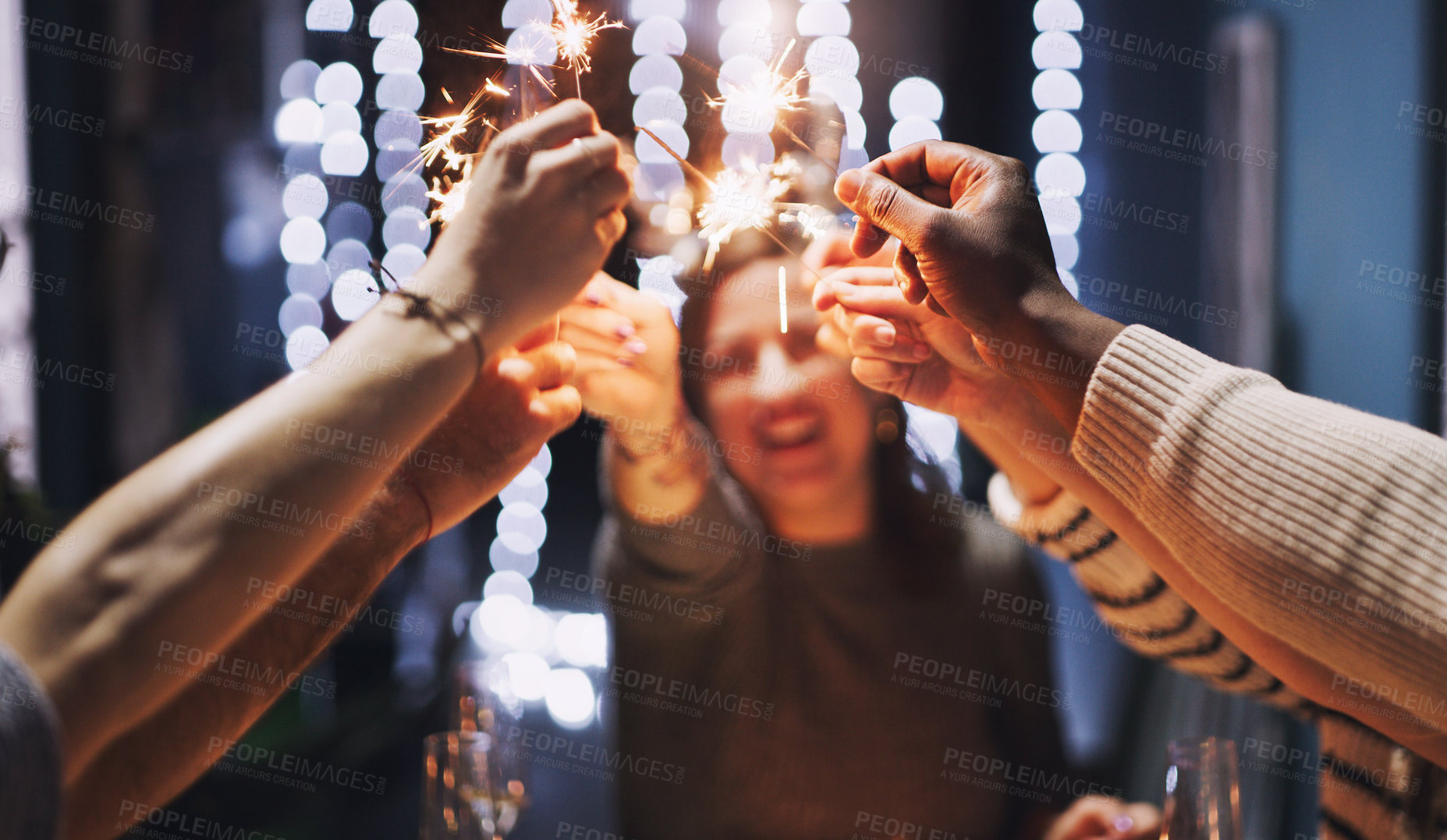 Buy stock photo New Year, happy and people with sparklers at party for celebration, collaboration and social gathering. Friends, hands and group with fireworks at event for countdown, tradition and holiday at night
