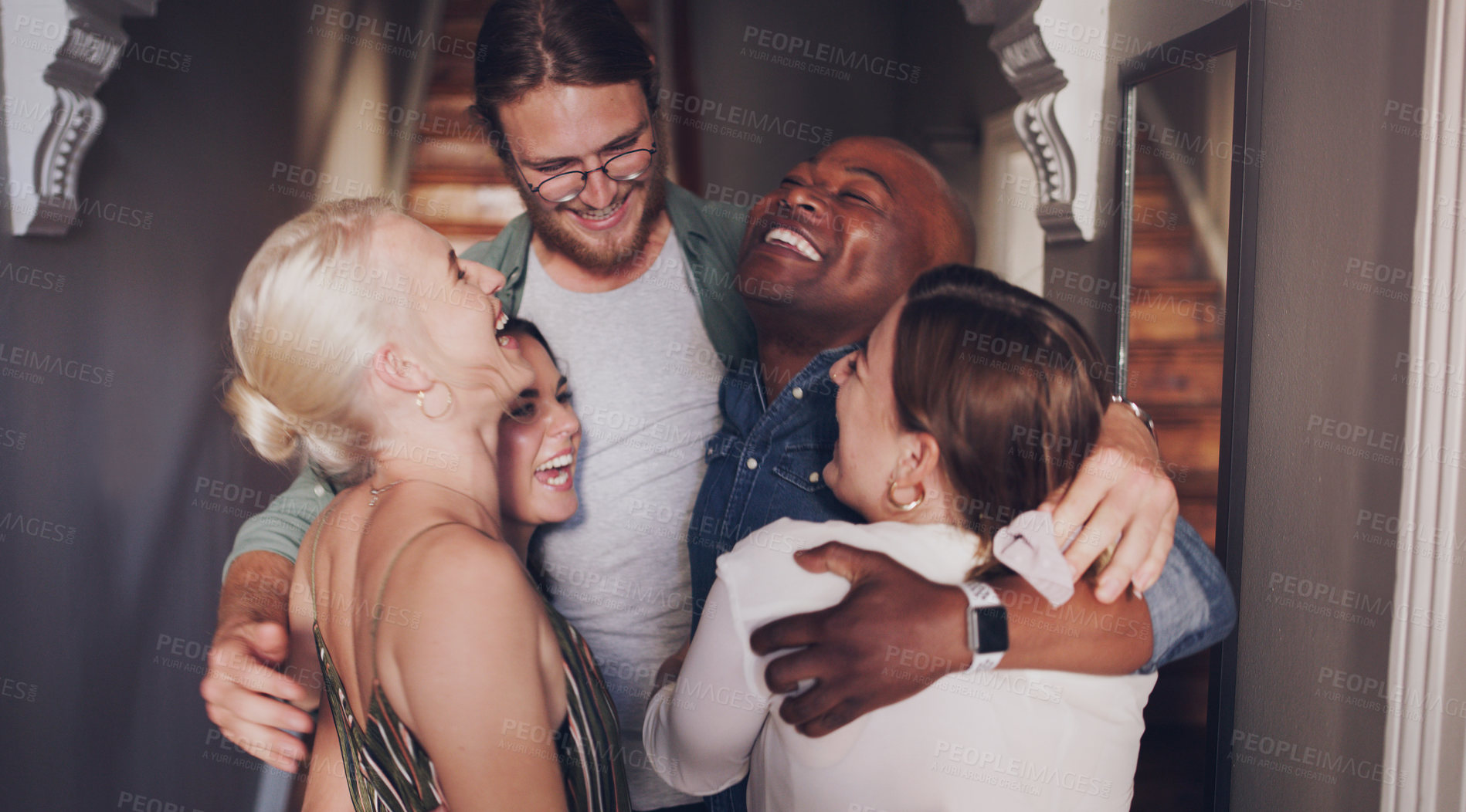 Buy stock photo Friends, hug and love while happy and excited at a party or social gathering with diversity, support and happy energy at a house celebration. Men and woman in huddle or circle to celebrate a reunion