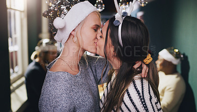 Buy stock photo Christmas, kiss and love with lesbian couple at party for celebration, festive and holiday. Lgbtq, gay and dance with women partners at xmas event for romance, social and relax at reunion gathering