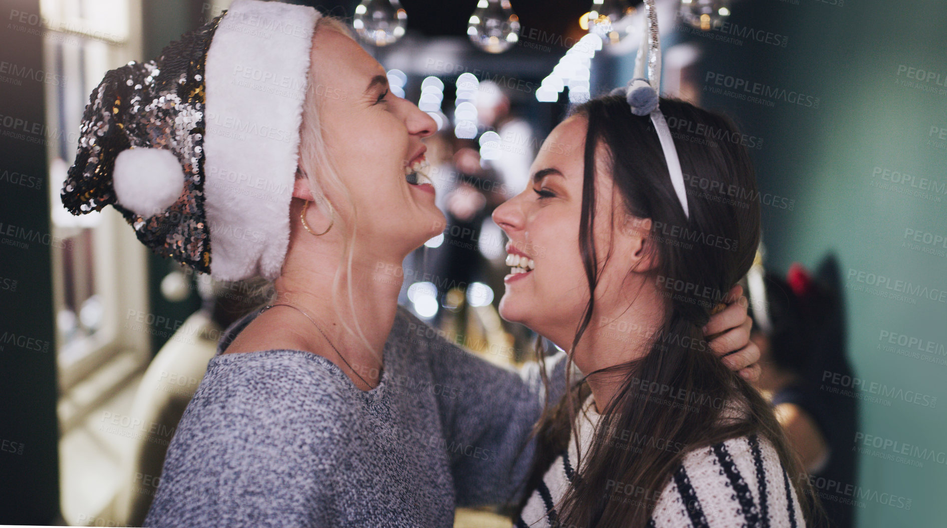 Buy stock photo Woman, lesbian and laughing at Christmas party for festive celebration or funny joke, connection or gathering. Female people, smile and lgbtq pride for queer relationship or holiday, love or home