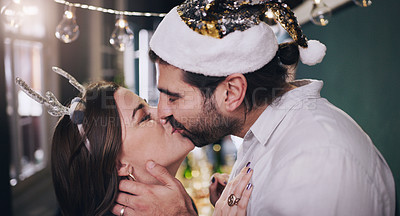 Buy stock photo Happy couple, Christmas and kiss with love for affection, embrace or intimacy on holiday at home. Man, woman or lovers with romance for intimate moment, care or compassion in new year celebration