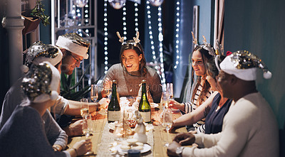 Buy stock photo Christmas dinner, champagne and group of friends in house for drinks, celebration and food with festive decor. Holiday party, table and people in home for social, fun and eating while on vacation