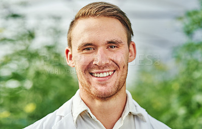 Buy stock photo Portrait of a handsome young scientist studying plants and crops outdoors on a farm