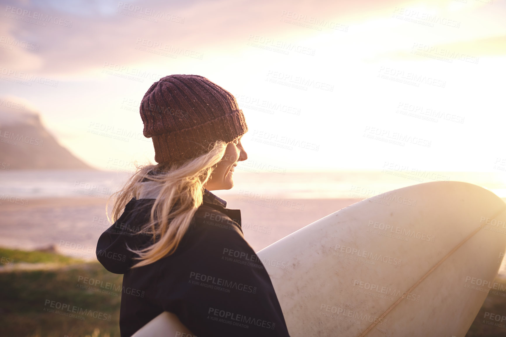 Buy stock photo Sunset, surfboard and woman by beach for travel with winter vacation, adventure or holiday. Thinking, surfing and female person on seaside weekend trip for outdoor watersports activity for hobby.