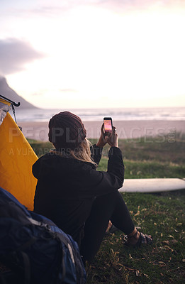 Buy stock photo Shot of an attractive young woman camping at her favourite surfing spot