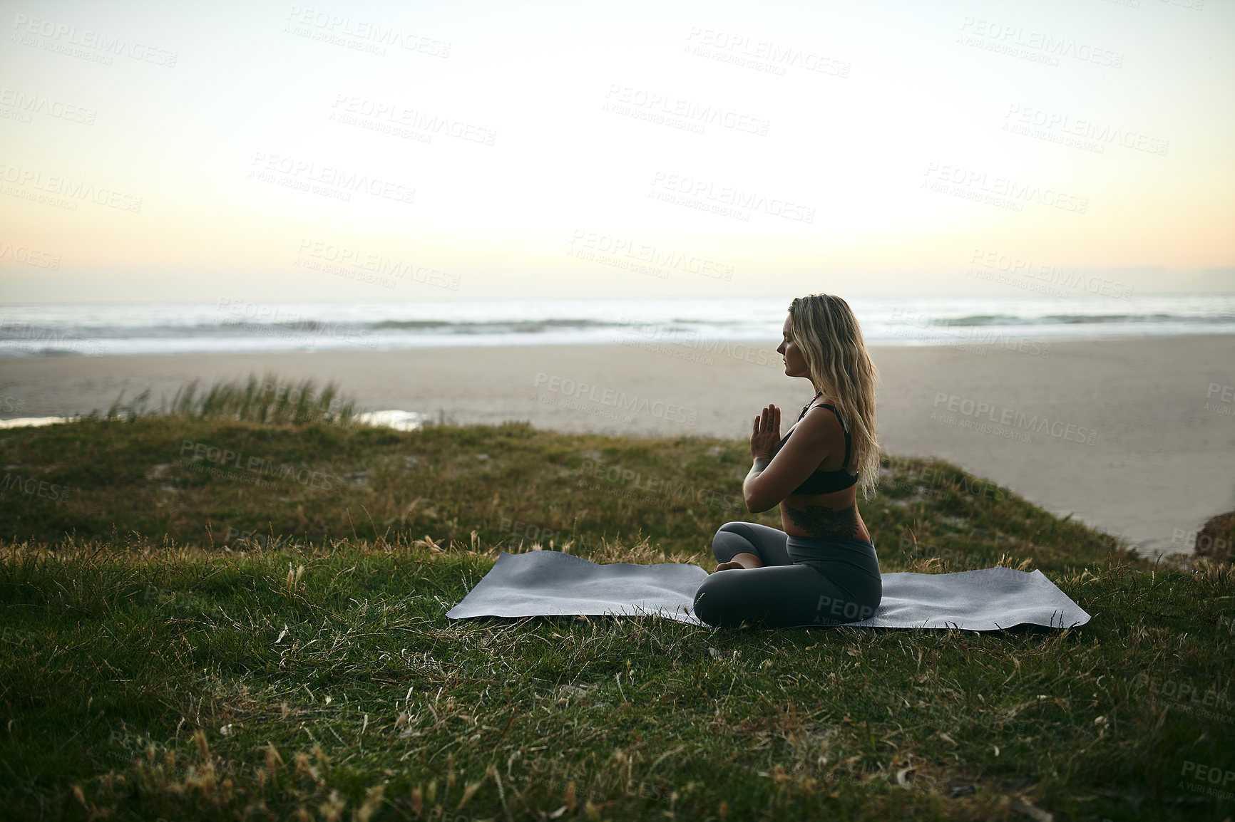 Buy stock photo Yoga, prayer hands and woman at beach for meditation, spiritual healing and calm to align chakra at space. Fitness girl, profile and pilates at ocean with zen, mental health balance and stress relief