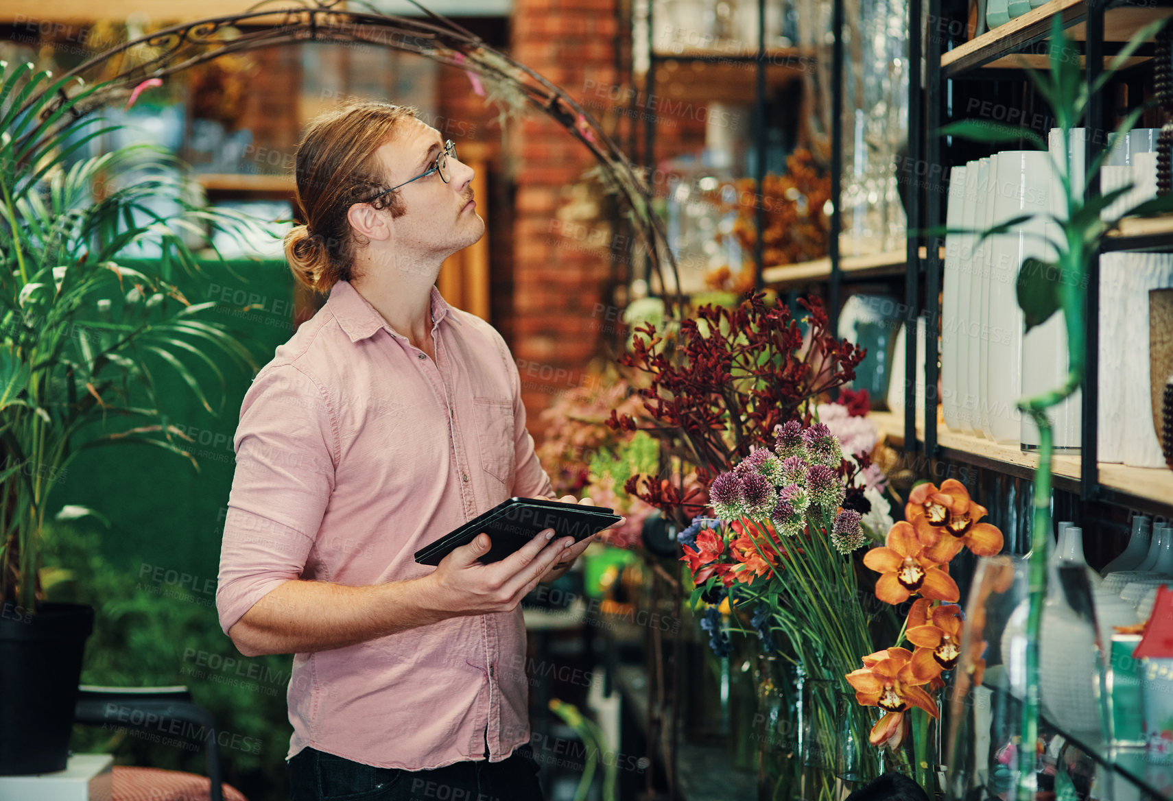 Buy stock photo Business, flower shop and man with tablet, plants and typing with internet, connection and digital app. Professional, entrepreneur and employee with tech, nature and check stock with inventory