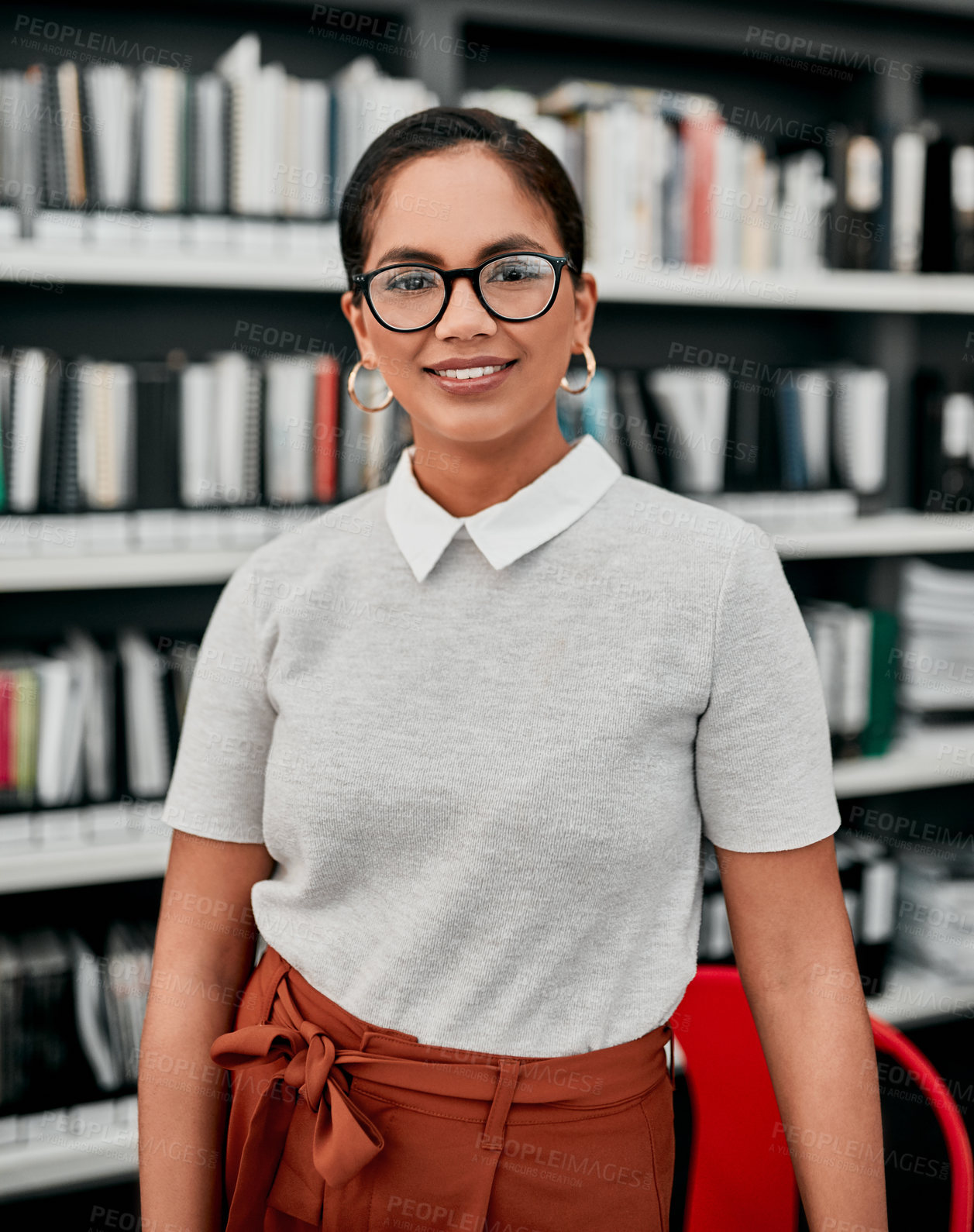 Buy stock photo Cropped portrait of an attractive young female architect smiling while standing in her office