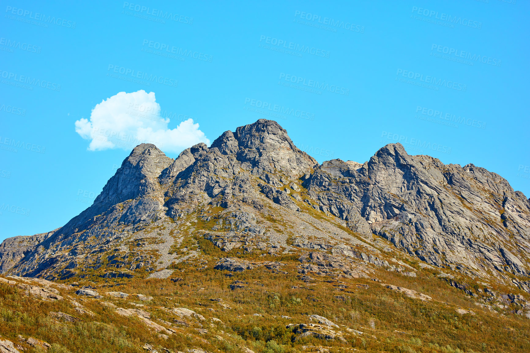 Buy stock photo Landscape view of mountains, blue sky with clouds and copy space in Norway. Hiking, discovering scenic countryside and rough terrain. Sun shining on vast background of nature expanse and hiking trail