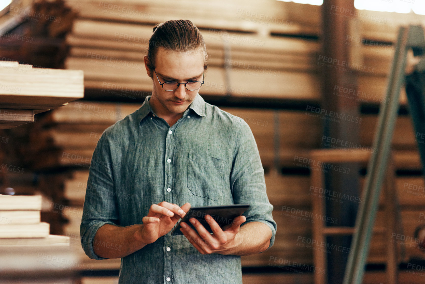 Buy stock photo Carpentry, tablet and man with wood in workshop for manufacturing, check inventory and furniture production. Woodworking, digital tech and person online for timber, lumber and construction business