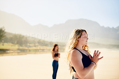 Buy stock photo Zen, meditation and group of women on beach with peace, health or wellness for holistic care. Namaste, relax and people at ocean for mindfulness, calm morning or outdoor yoga class in nature together