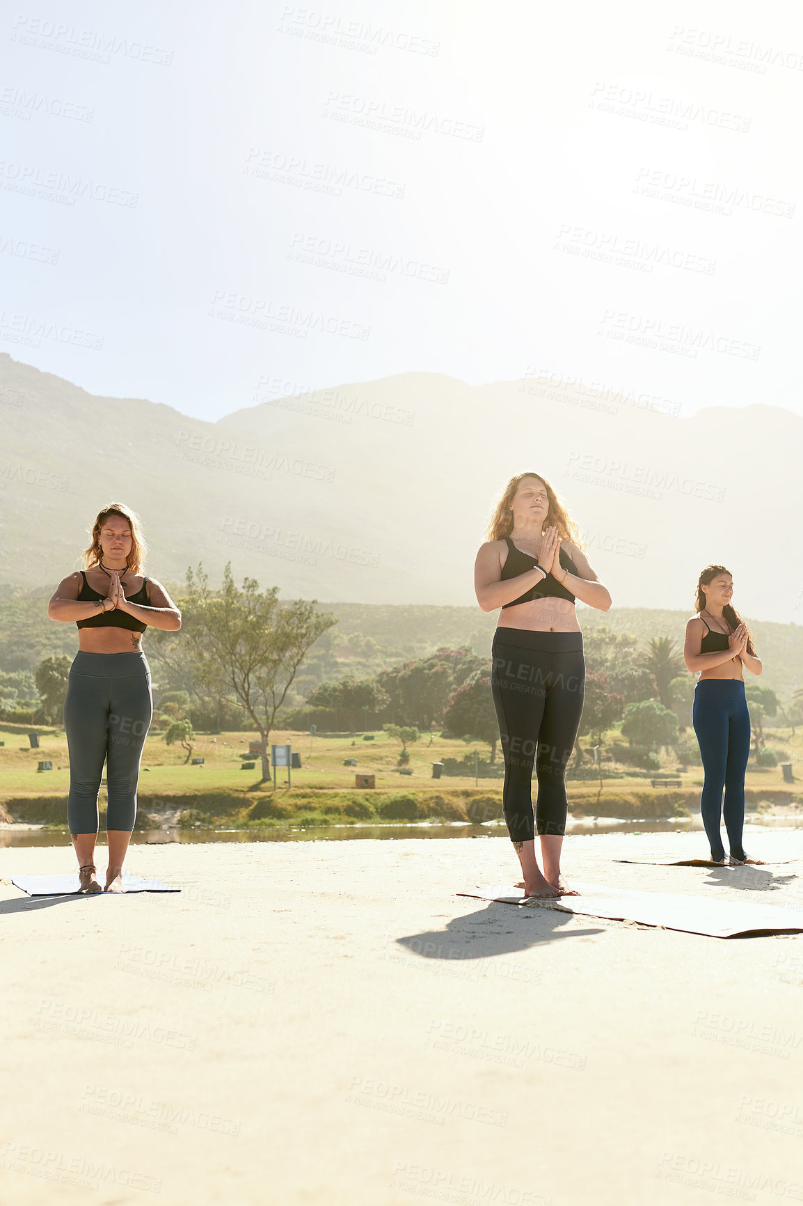 Buy stock photo Peace, meditation and group of women in park with namaste, health or wellness for holistic care. Zen, relax and people in nature for mindfulness, calm morning practice or outdoor yoga class together