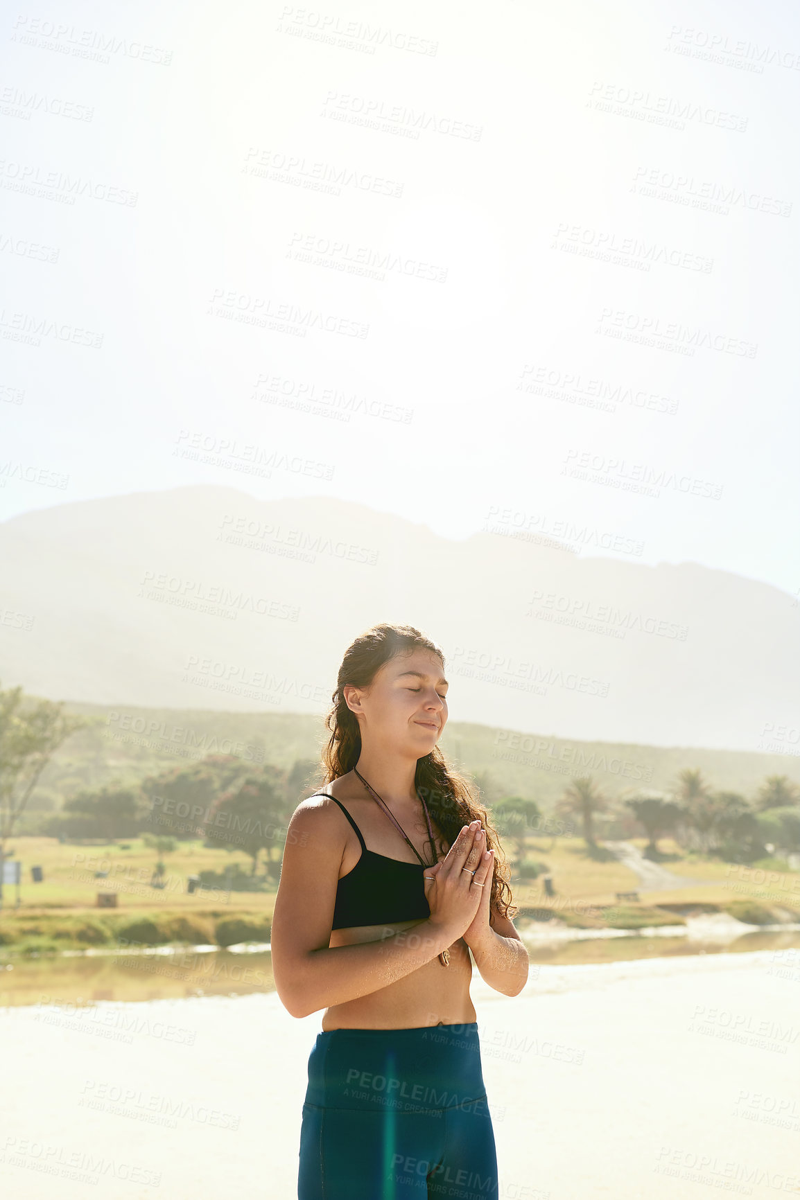 Buy stock photo Namaste, meditation and woman at ocean with peace, health or wellness for holistic outdoor care. Zen, relax and girl at beach for mindfulness, calm practice and yoga in nature for spiritual wellbeing