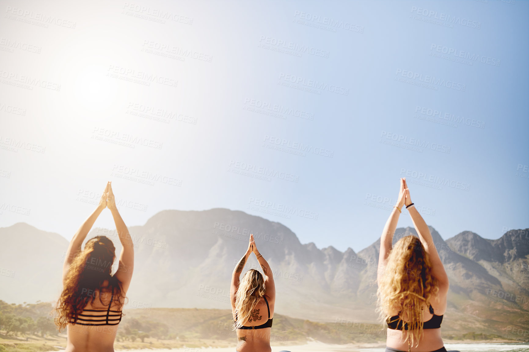 Buy stock photo Back, yoga and women with meditation, beach and calm with wellness, chakra and morning routine. Group, friends and people with pilates training, breathing and hands together with fitness and exercise