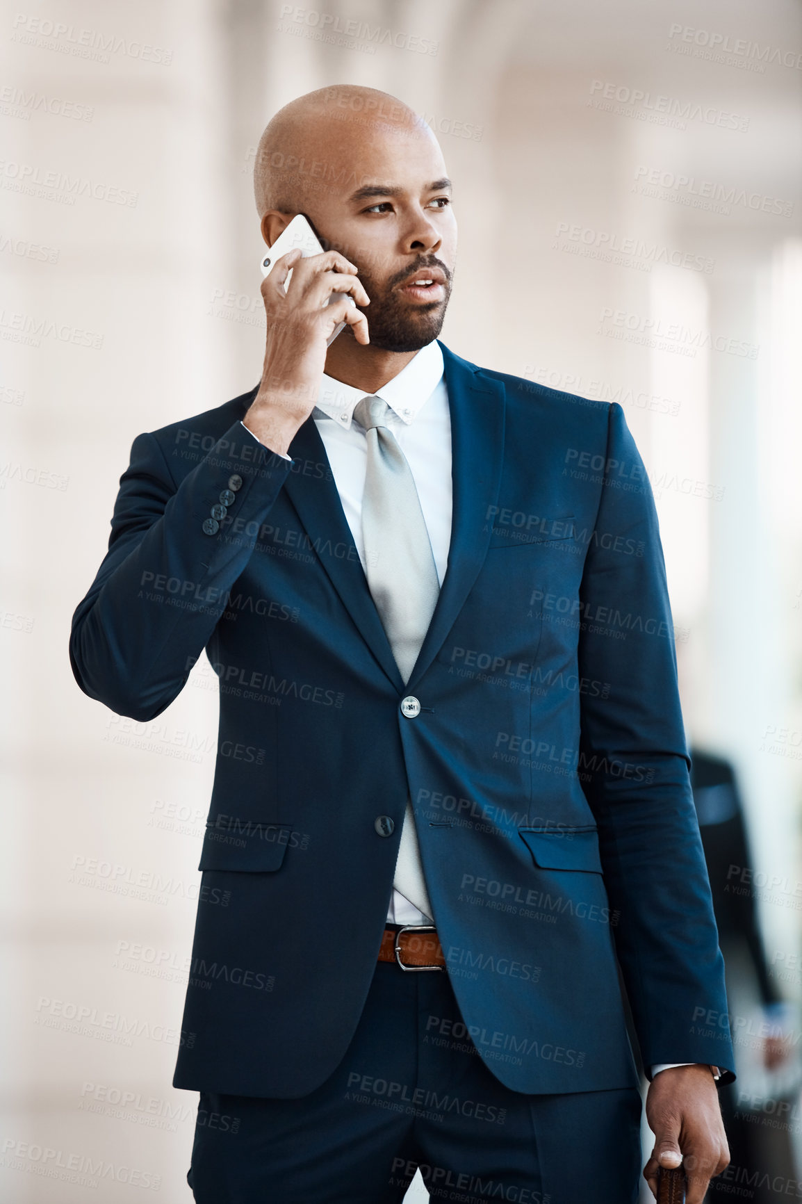 Buy stock photo Cropped shot of a handsome businessman on a call outside
