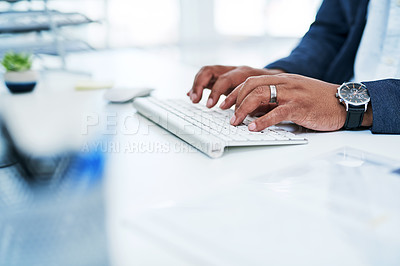 Buy stock photo Closeup shot of an unrecognisable businessman working on a computer in an office
