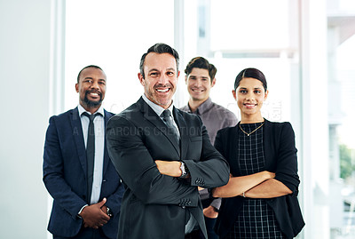 Buy stock photo Portrait of a diverse group of businesspeople standing together in an office