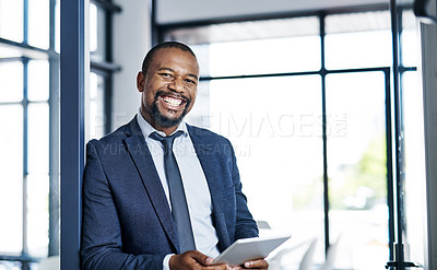 Buy stock photo Cropped portrait of a handsome middle aged businessman smiling while holding a digital tablet in a modern office