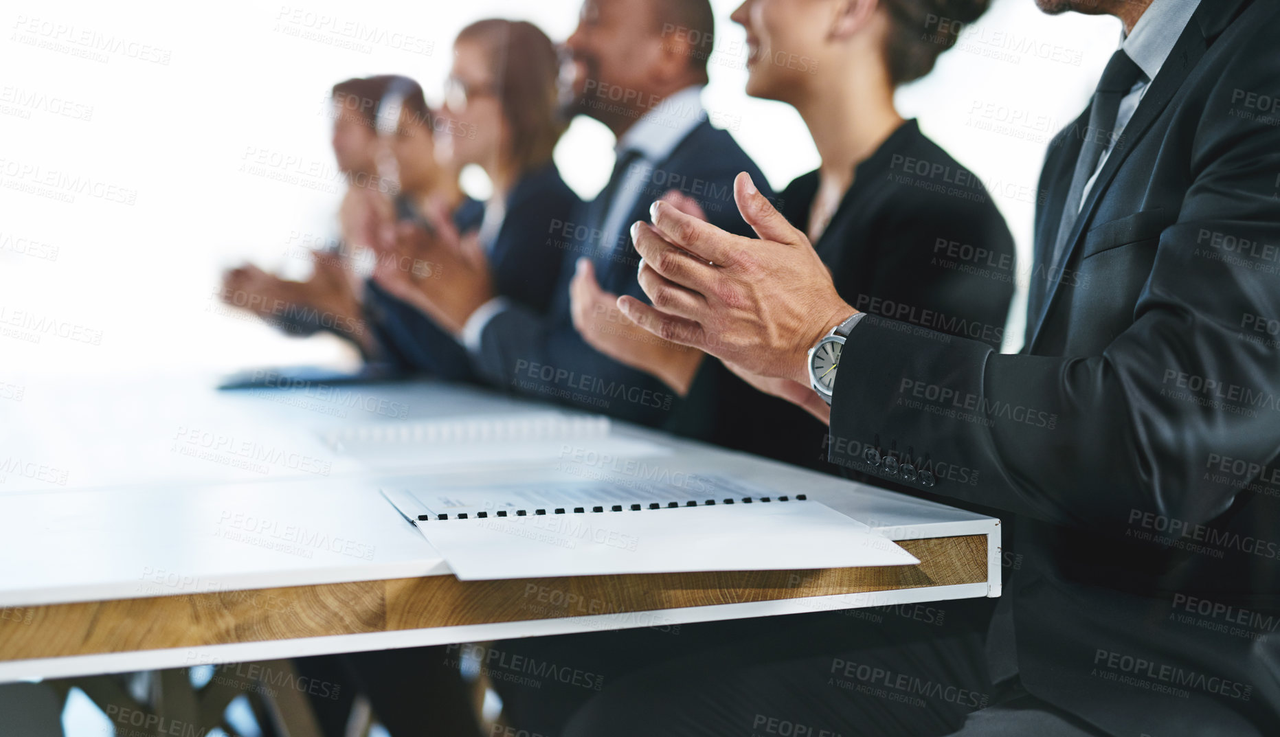 Buy stock photo Cropped shot of a group of unrecognizable businesspeople applauding at a conference