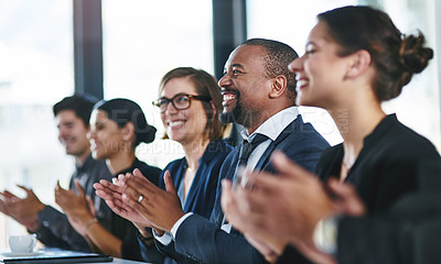 Buy stock photo Cropped shot of a diverse group of young businesspeople applauding during a conference