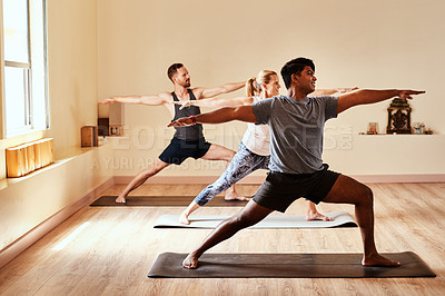 Buy stock photo Warrior pose, yoga and calm with people in class for holistic health, flexibility and workout. Pilates, exercise and healing with group of friends in studio for breathing, zen and wellness balance