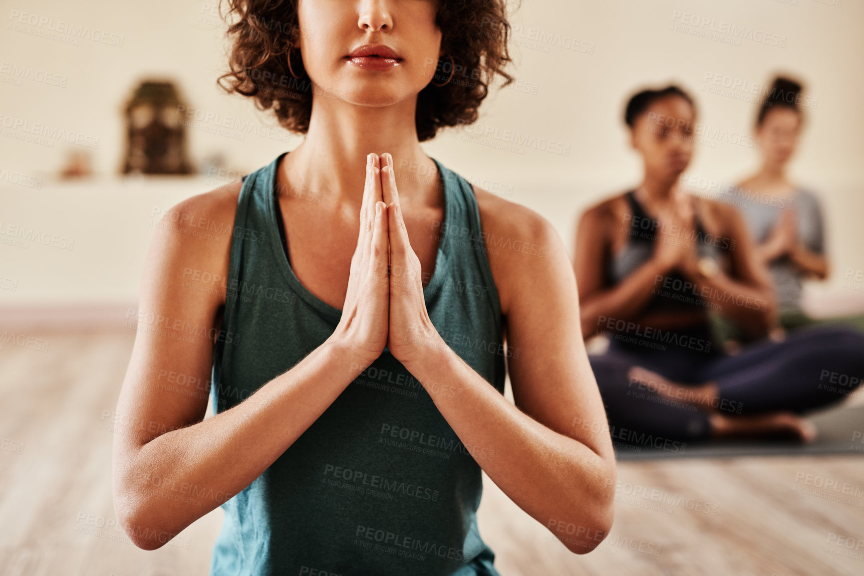 Buy stock photo Shot of a group of young women meditating in a yoga class