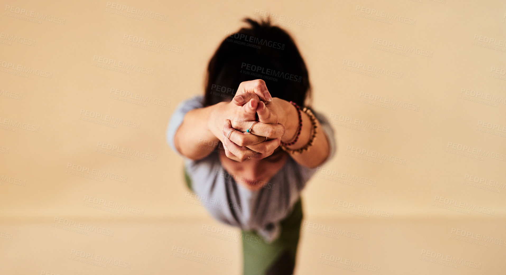 Buy stock photo Shot of a young women meditating during a yoga session