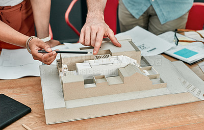 Buy stock photo Hands, people and model of building at architecture agency with review, point and planning with teamwork. Engineer, partnership and 3D construction with blueprint, check and inspection for property