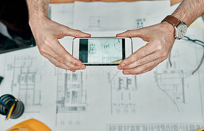 Buy stock photo Hands, architect and blueprint with phone for photo for communication with client, council or review. Person, engineer and floor plan with mobile app, development and design at construction agency