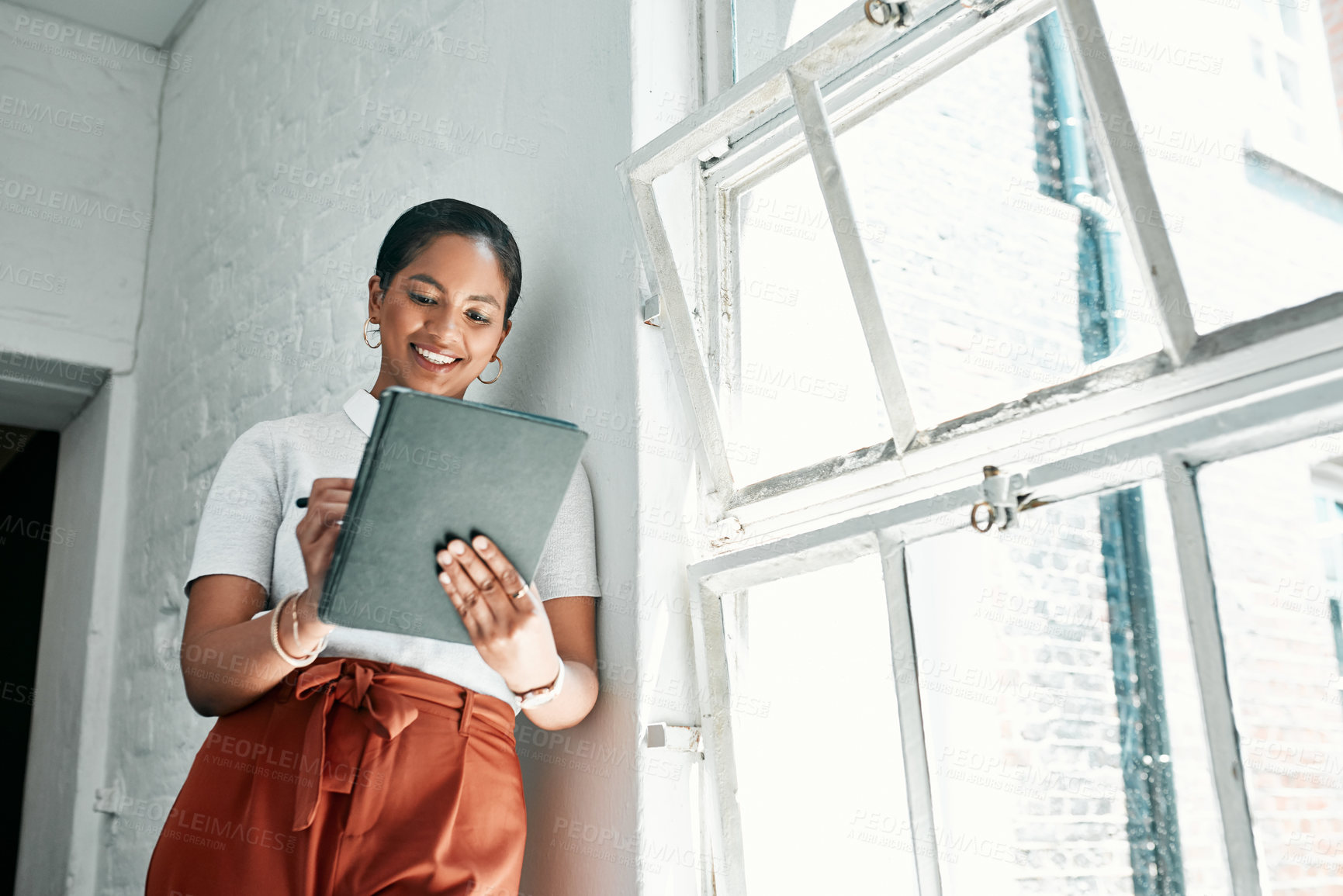 Buy stock photo Smile, businesswoman and tablet in office for reading, research and online information for publication. Creative agency, journalist and planning on digital for political story, article and editing