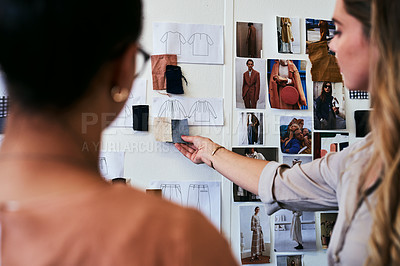 Buy stock photo Cropped shot of two fashion designers discussing ideas