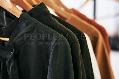 Buy stock photo Cropped shot of clothes hanging on a railing