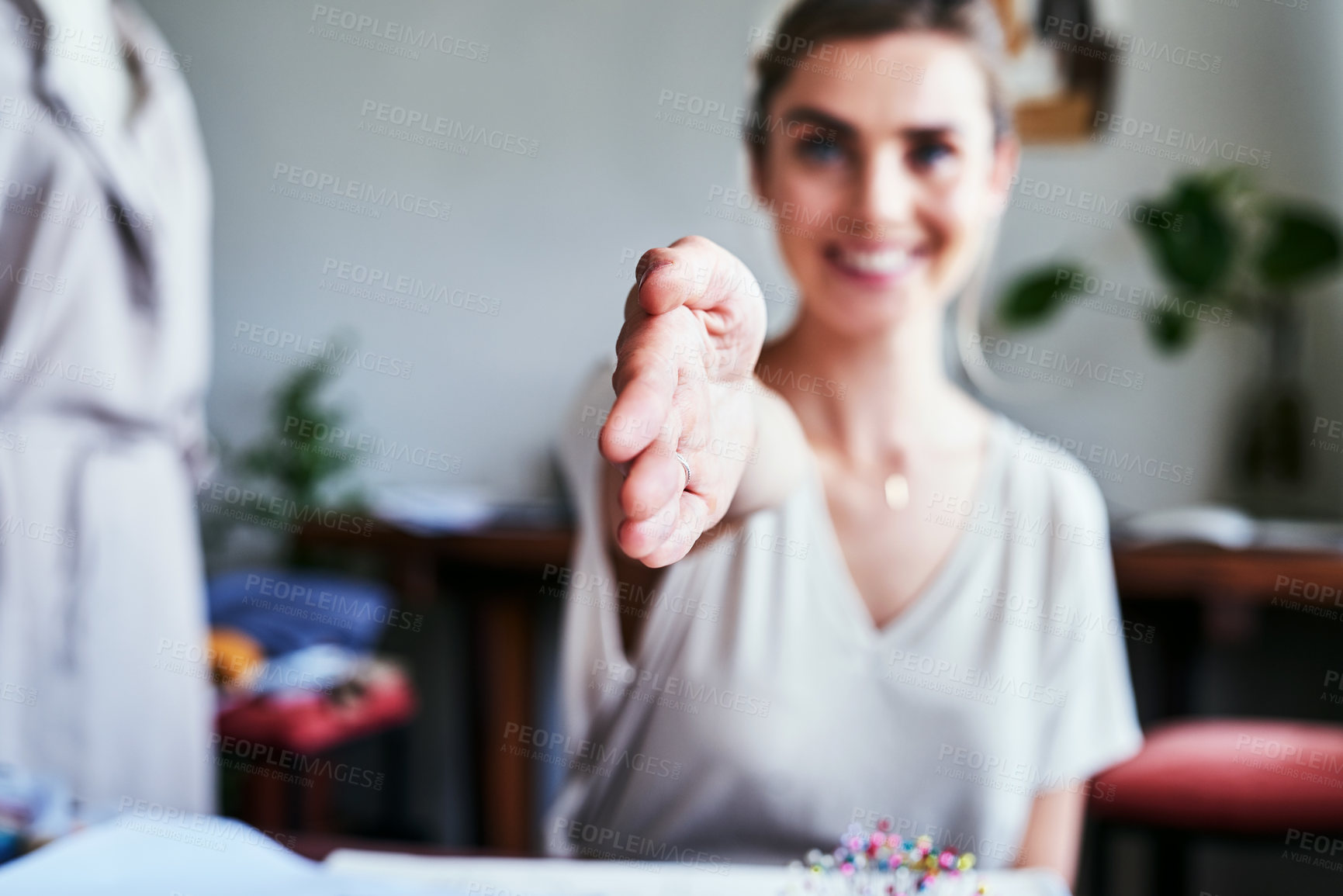 Buy stock photo Cropped shot of an unrecognizable businesswoman reaching out for a handshake