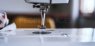 Buy stock photo Sewing machine, needle and thread for fashion in workshop for manufacturing clothes for design. Creative, tailoring and dressmaker equipment with cotton for stitches in production at textile factory.