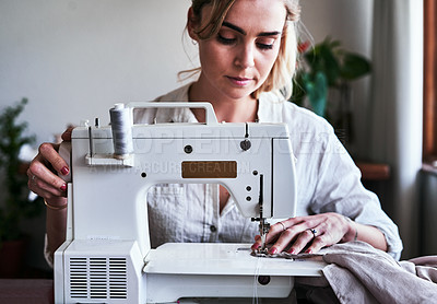 Buy stock photo Fashion, woman and textile designer at sewing machine, sustainable business with creative ideas and focus. Creativity, start up and design, or tailor at table stitching fabric, entrepreneur at work.