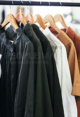 Buy stock photo Cropped shot of clothes hanging on a railing
