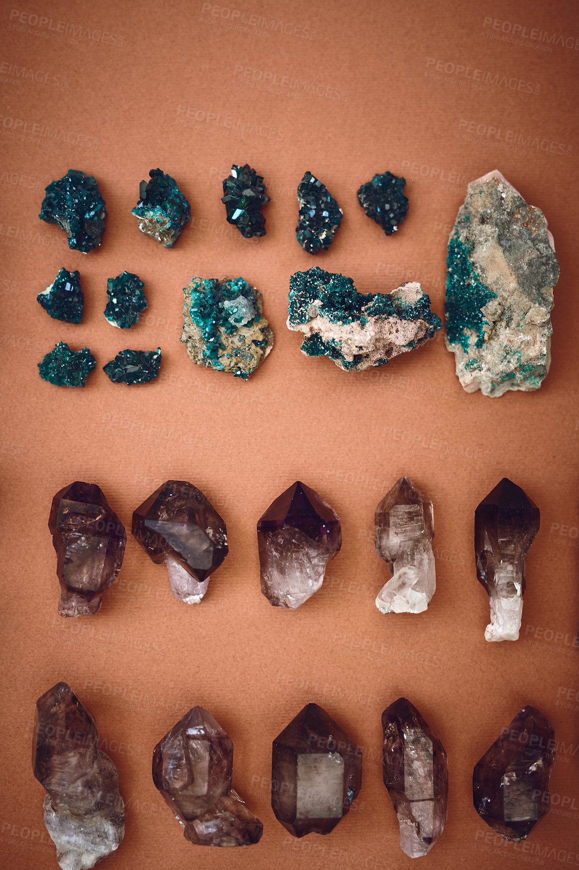 Buy stock photo High angle shot of a table filled with different types of crystals inside during the day