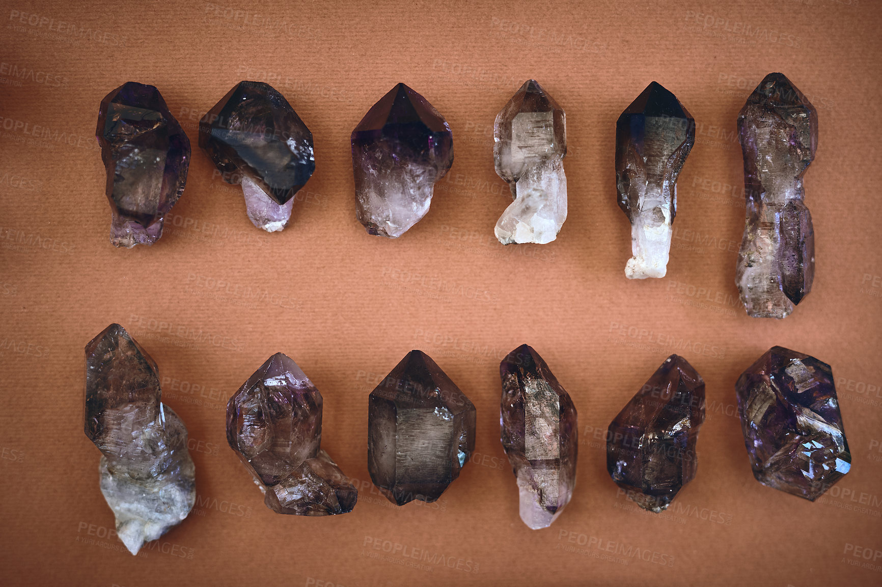 Buy stock photo High angle shot of a table filled with different types of crystals inside during the day