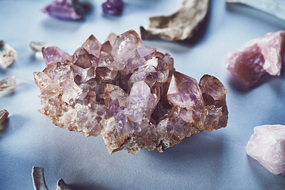 Buy stock photo Closeup of a beautiful crystal placed on a table with other different types of crystals during the day