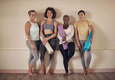 Buy stock photo Full length portrait of a young group of woman sitting together and bonding during an indoor yoga session